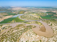 The meandering Tarim River is nourishing vegetation along its banks in the Weili section of the middle and lower reaches of the Tarim River...