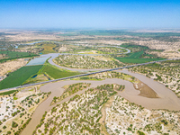 The meandering Tarim River is nourishing vegetation along its banks in the Weili section of the middle and lower reaches of the Tarim River...