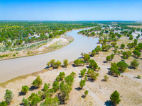 The meandering Tarim River is nourishing vegetation along its banks in the Weili section of the middle and lower reaches of the Tarim River...