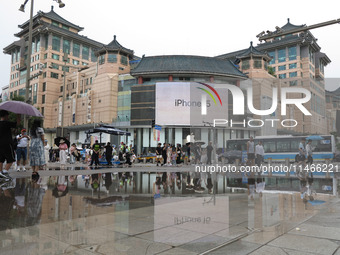 A photo is showing the Wangfujing Pedestrian Street after rain in Beijing, China, on August 10, 2024. (