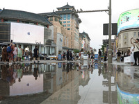 A photo is showing the Wangfujing Pedestrian Street after rain in Beijing, China, on August 10, 2024. (