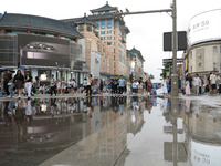 A photo is showing the Wangfujing Pedestrian Street after rain in Beijing, China, on August 10, 2024. (