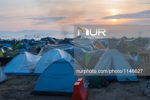 Sunrises over tents in Idomeni camp on April 6, 2016. A plan to send back migrants from Greece to Turkey sparked demonstrations by local res...