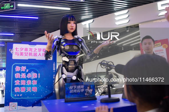 Humanoid robot Xiao Qi is having a dialogue with visitors during the event of Qixi, a traditional Chinese Valentine festival, at Long Zhi Mo...