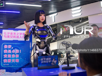 Humanoid robot Xiao Qi is having a dialogue with visitors during the event of Qixi, a traditional Chinese Valentine festival, at Long Zhi Mo...