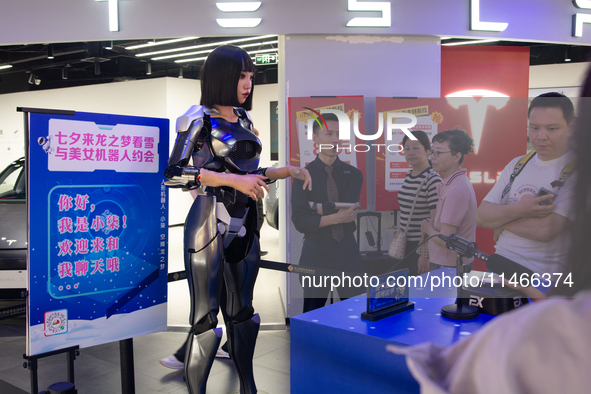 Humanoid robot Xiao Qi is having a dialogue with visitors during the event of Qixi, a traditional Chinese Valentine festival, at Long Zhi Mo...