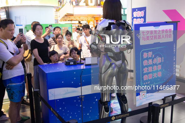 Humanoid robot Xiao Qi is having a dialogue with visitors during the event of Qixi, a traditional Chinese Valentine festival, at Long Zhi Mo...