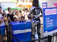 Humanoid robot Xiao Qi is having a dialogue with visitors during the event of Qixi, a traditional Chinese Valentine festival, at Long Zhi Mo...