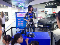 Humanoid robot Xiao Qi is having a dialogue with visitors during the event of Qixi, a traditional Chinese Valentine festival, at Long Zhi Mo...