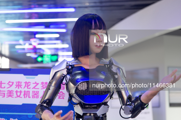 Humanoid robot Xiao Qi is having a dialogue with visitors during the event of Qixi, a traditional Chinese Valentine festival, at Long Zhi Mo...