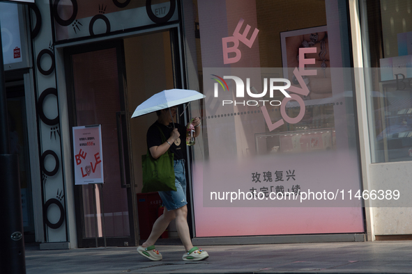 A ''Be Love'' sign is being seen during Qixi, a Chinese traditional Valentine, in Shanghai, China, on August 10, 2024. 