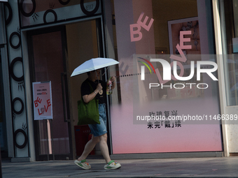 A ''Be Love'' sign is being seen during Qixi, a Chinese traditional Valentine, in Shanghai, China, on August 10, 2024. (