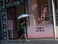 A ''Be Love'' sign is being seen during Qixi, a Chinese traditional Valentine, in Shanghai, China, on August 10, 2024. (