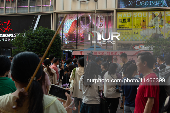 A large screen displaying ''Happy Qixi'' is being seen on Nanjing Road during Qixi, a Chinese traditional Valentine, in Shanghai, China, on...