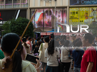 A large screen displaying ''Happy Qixi'' is being seen on Nanjing Road during Qixi, a Chinese traditional Valentine, in Shanghai, China, on...