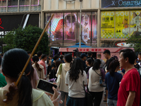 A large screen displaying ''Happy Qixi'' is being seen on Nanjing Road during Qixi, a Chinese traditional Valentine, in Shanghai, China, on...