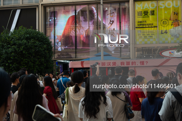 A large screen displaying ''Happy Qixi'' is being seen on Nanjing Road during Qixi, a Chinese traditional Valentine, in Shanghai, China, on...