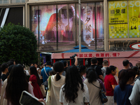 A large screen displaying ''Happy Qixi'' is being seen on Nanjing Road during Qixi, a Chinese traditional Valentine, in Shanghai, China, on...