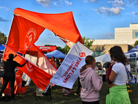 A tent from a cannabis vendor is almost blowing away during a festival as strong winds are sweeping across the city of Toronto, Ontario, Can...