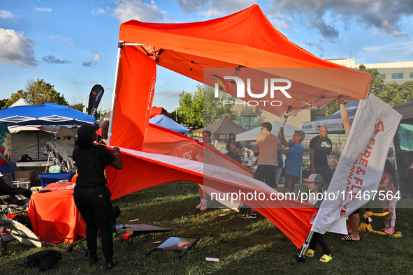 A tent from a cannabis vendor is almost blowing away during a festival as strong winds are sweeping across the city of Toronto, Ontario, Can...