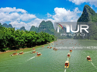 Tourists are visiting the Li River on a raft in Guilin, China, on August 8, 2024. (