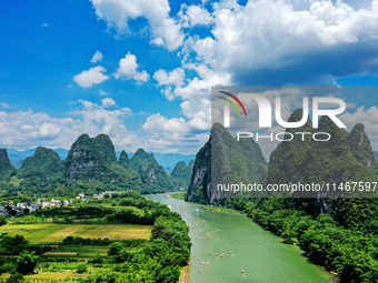 Tourists are visiting the Li River on a raft in Guilin, China, on August 8, 2024. (