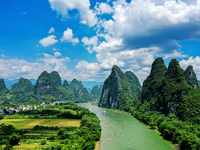 Tourists are visiting the Li River on a raft in Guilin, China, on August 8, 2024. (