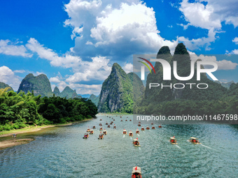 Tourists are visiting the Li River on a raft in Guilin, China, on August 8, 2024. (