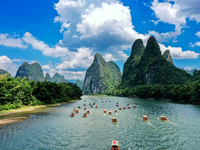 Tourists are visiting the Li River on a raft in Guilin, China, on August 8, 2024. (