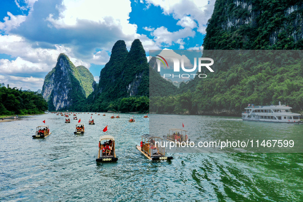 Tourists are visiting the Li River on a raft in Guilin, China, on August 8, 2024. 