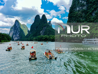 Tourists are visiting the Li River on a raft in Guilin, China, on August 8, 2024. (