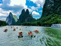 Tourists are visiting the Li River on a raft in Guilin, China, on August 8, 2024. (