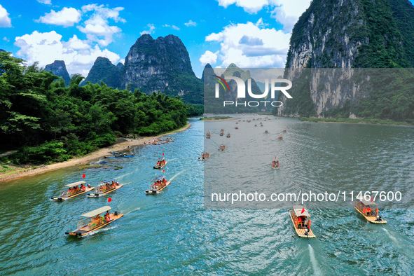 Tourists are visiting the Li River on a raft in Guilin, China, on August 8, 2024. 