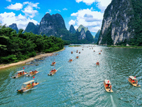 Tourists are visiting the Li River on a raft in Guilin, China, on August 8, 2024. (