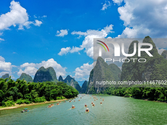 Tourists are visiting the Li River on a raft in Guilin, China, on August 8, 2024. (