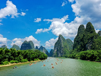 Tourists are visiting the Li River on a raft in Guilin, China, on August 8, 2024. (