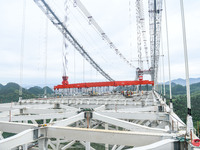 Workers are working at the construction site of Jinzhou Bridge in Xingyi, China, on August 11, 2024. (