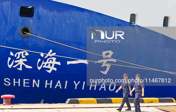 Customs officers of Qingdao Dagang Port are boarding a ship to carry out ship supervision work in Qingdao, Shandong province, China, on Augu...