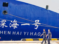 Customs officers of Qingdao Dagang Port are boarding a ship to carry out ship supervision work in Qingdao, Shandong province, China, on Augu...