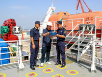 Customs officers at Qingdao Dagang are checking ship declaration documents on the spot in Qingdao, Shandong province, China, on August 11, 2...