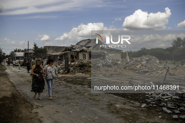 A residential building in a village in the Kyiv region is being heavily damaged during a massive Russian missile and drone attack on Ukraine...