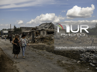 A residential building in a village in the Kyiv region is being heavily damaged during a massive Russian missile and drone attack on Ukraine...