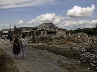 A residential building in a village in the Kyiv region is being heavily damaged during a massive Russian missile and drone attack on Ukraine...