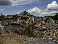 A residential building in a village in the Kyiv region is being heavily damaged during a massive Russian missile and drone attack on Ukraine...