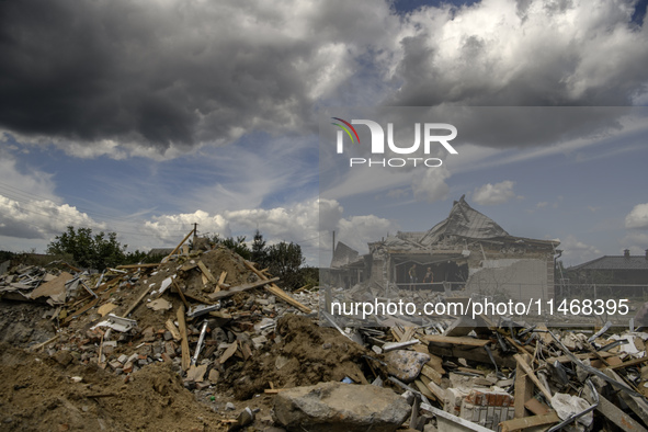 A residential building in a village in the Kyiv region is being heavily damaged during a massive Russian missile and drone attack on Ukraine...