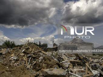 A residential building in a village in the Kyiv region is being heavily damaged during a massive Russian missile and drone attack on Ukraine...