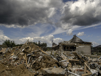 A residential building in a village in the Kyiv region is being heavily damaged during a massive Russian missile and drone attack on Ukraine...