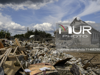 A residential building in a village in the Kyiv region is being heavily damaged during a massive Russian missile and drone attack on Ukraine...