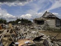 A residential building in a village in the Kyiv region is being heavily damaged during a massive Russian missile and drone attack on Ukraine...