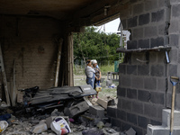 A residential building in a village in the Kyiv region is being heavily damaged during a massive Russian missile and drone attack on Ukraine...